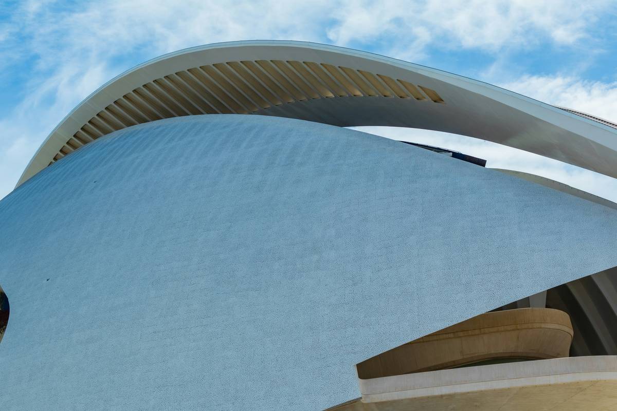 Side-by-side comparison: rigid glass solar panel vs. ultra-thin flexible panel bending over a curved RV roof