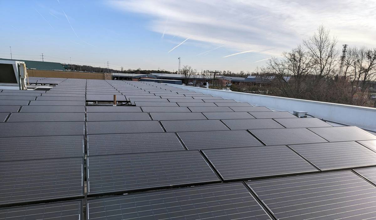 Close-up of solar panels smooth surface installation showing proper edge sealing with butyl tape