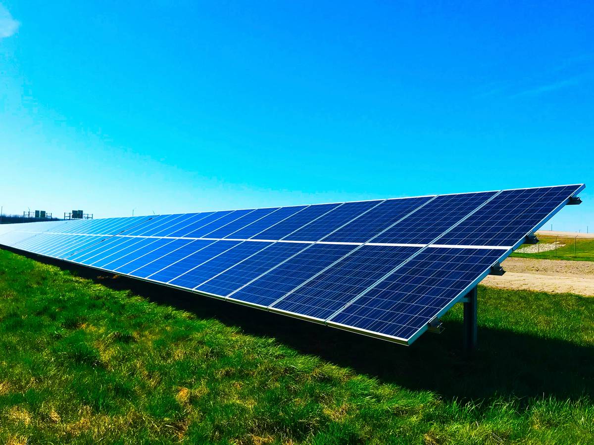 Close-up of flexible solar panel being bent during installation showing can solar panels be curved capability